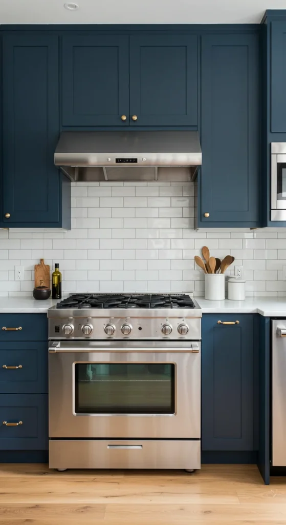 7 Blue Kitchen Ideas to Inspire a Cabinet Refresh Dark denim blue cabinets in a sleek modern kitchen