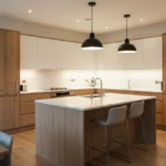 Modern kitchen with layered lighting combining ceiling, pendant, and under-cabinet lights