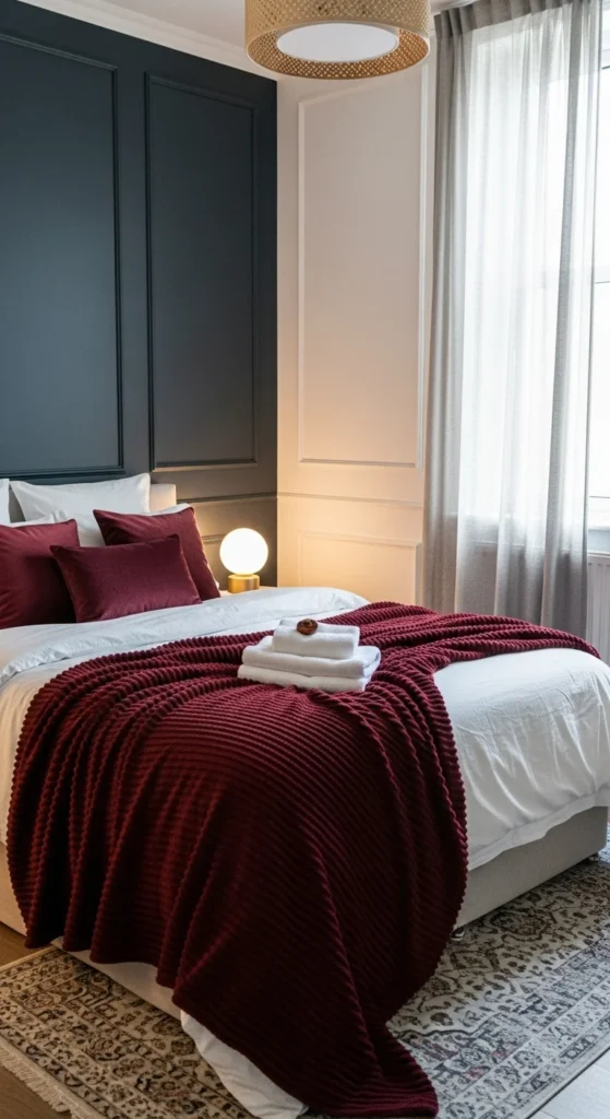 7 Dark Bedroom Ideas for a Cozy & Serene Retreat Dark bedroom with charcoal accent wall and burgundy decor