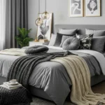 Elegant grey bedroom with layered textures and gold lighting