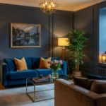 Moody navy-toned living room with cozy, layered lighting and a reading nook