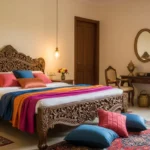 Warm Indian-themed bedroom with carved wood bed and silk textiles